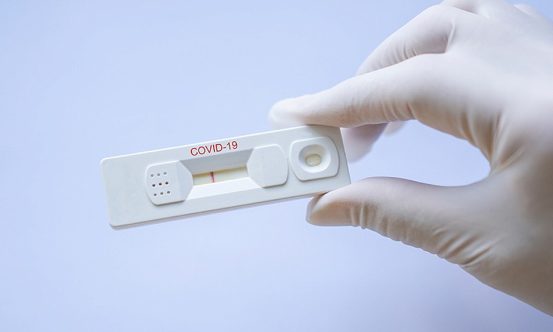 What happens if a member tests positive for COVID 19 while staying at the resort?